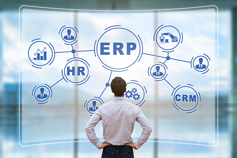 Person looking at enterprise resource planning (ERP) and customer relationship management (CRM) infographic. 